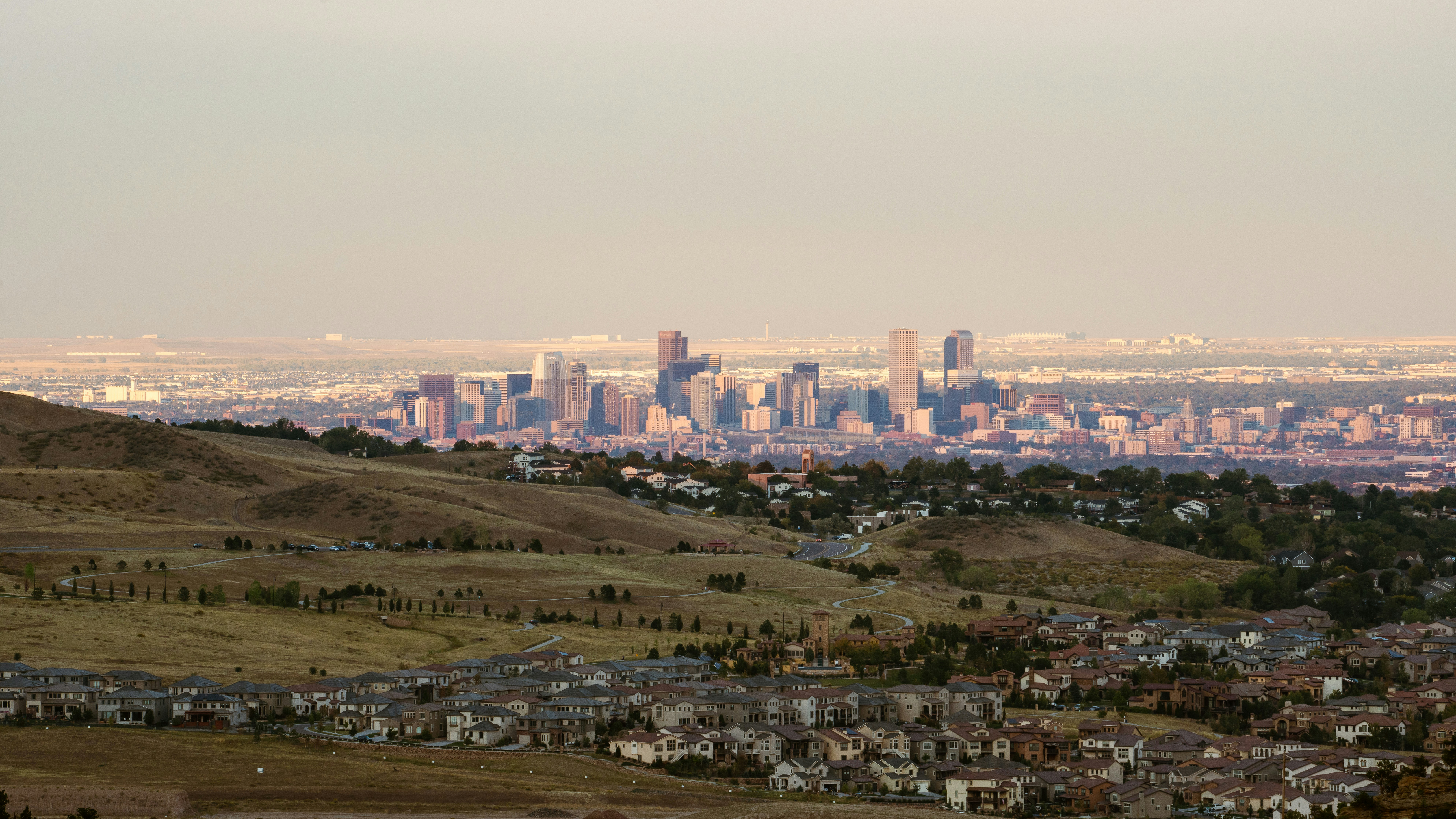 Denver skyline at sunset viewed from the hills